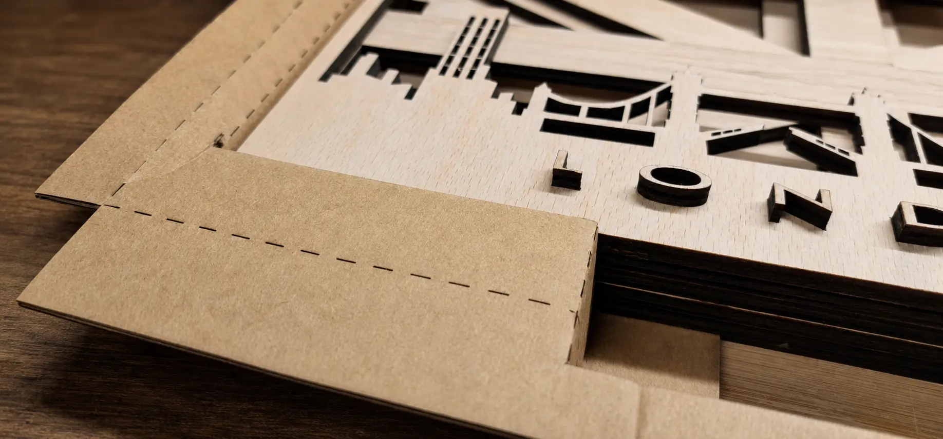 Close view showing the stacked plywood layers and fitted card packaging